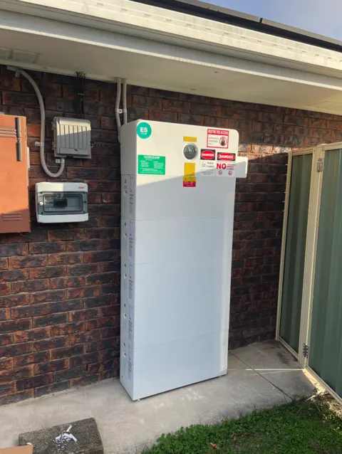 GoodWe stacked home battery — outdoor wall-side install