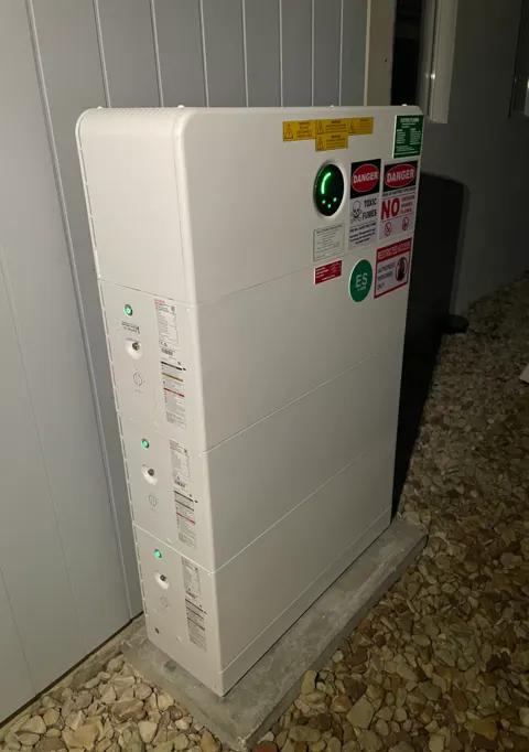 GoodWe stacked home battery — outdoor install on concrete pad